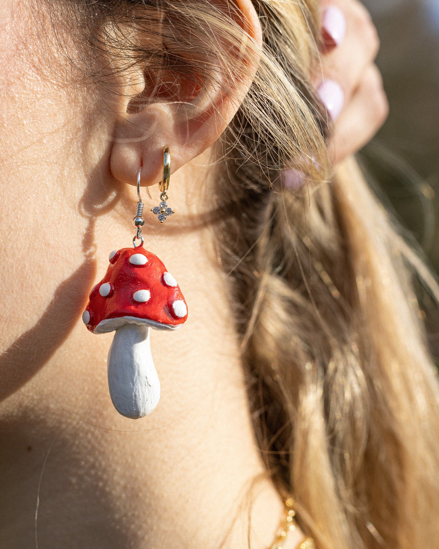 Goblin core ForHer renfaire fairycore cosplay. Polymer clay handmade handsculpted clay earrings with a groovy mushroom style. red, black, pink, blue, white