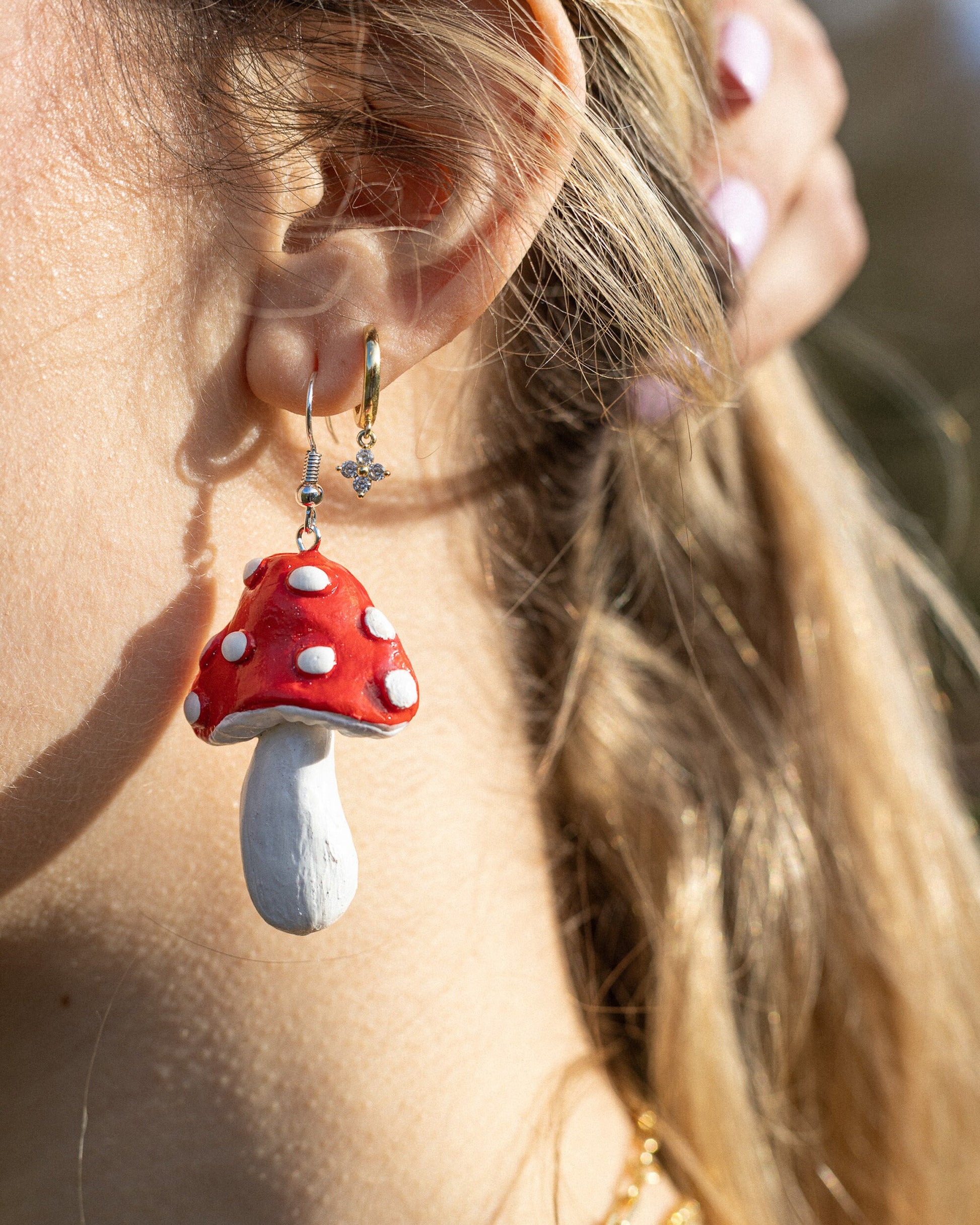 Goblin core ForHer renfaire fairycore cosplay. Polymer clay handmade handsculpted clay earrings with a groovy mushroom style. red, black, pink, blue, white