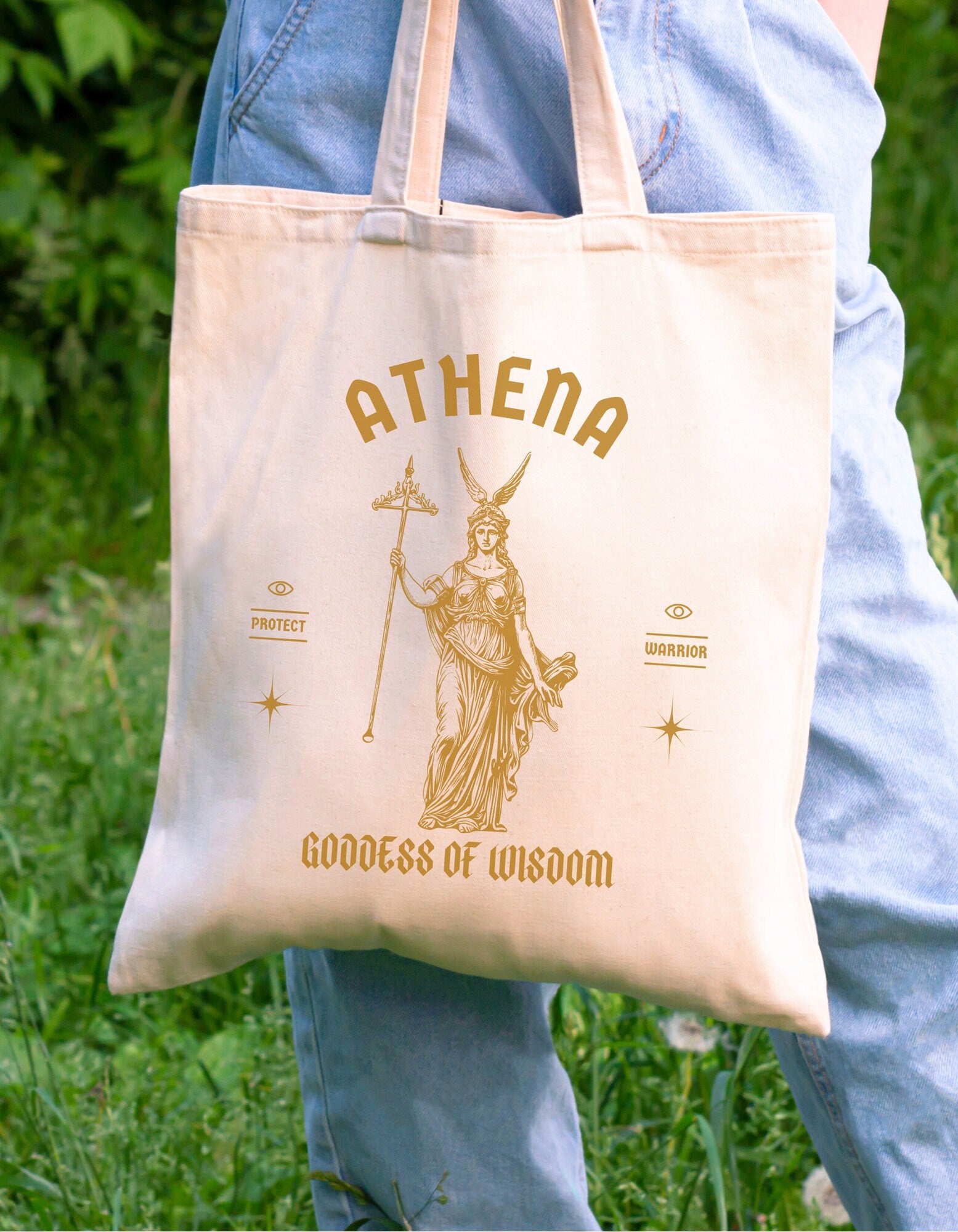 A cotton canvas totebag featuring various goddess designs including Demeter, Persephone, Aphrodite, Artemis, and Athena. The totebags come in shades of pink, gold, red, and black, of each goddess.