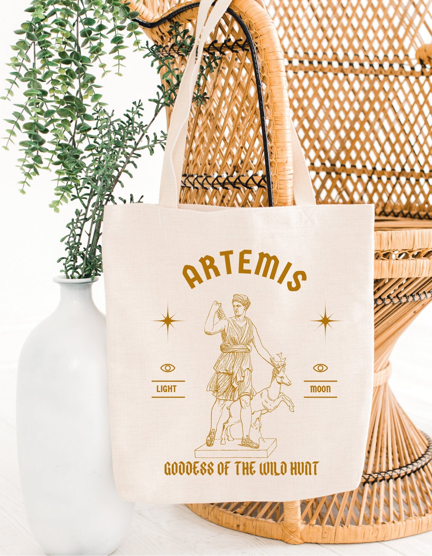 A cotton canvas totebag featuring various goddess designs including Demeter, Persephone, Aphrodite, Artemis, and Athena. The totebags come in shades of pink, gold, red, and black, of each goddess.